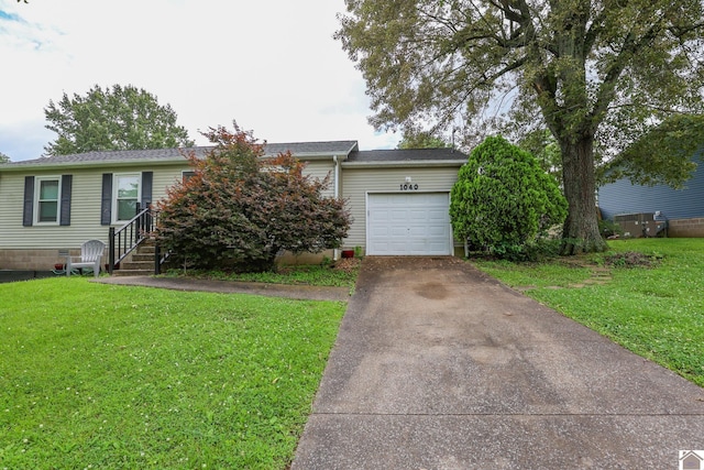 1040 Weda Cir, Mayfield, KY 42066 - view of front of property with a garage, driveway, and a front lawn