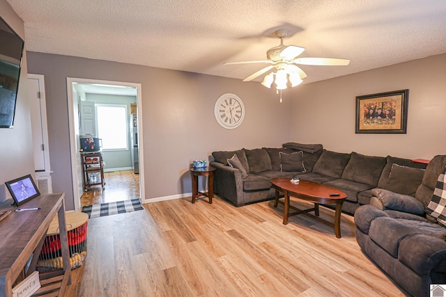 1040 Weda Cir, Mayfield, KY 42066 - living area featuring a ceiling fan, light wood-style floors, and a textured ceiling