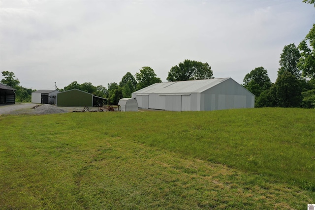 20715 Dawson Springs Rd, Dawson Springs, KY 42408 - view of grassy yard with a pole building and an outdoor structure