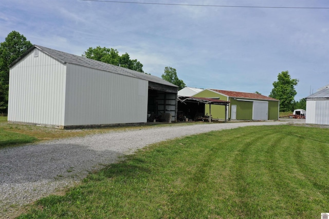 20715 Dawson Springs Rd, Dawson Springs, KY 42408 - view of pole building with a lawn, gravel driveway, and a carport