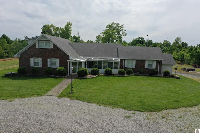 20715 Dawson Springs Rd, Dawson Springs, KY 42408 - view of front facade featuring brick siding, a front lawn, and a sunroom