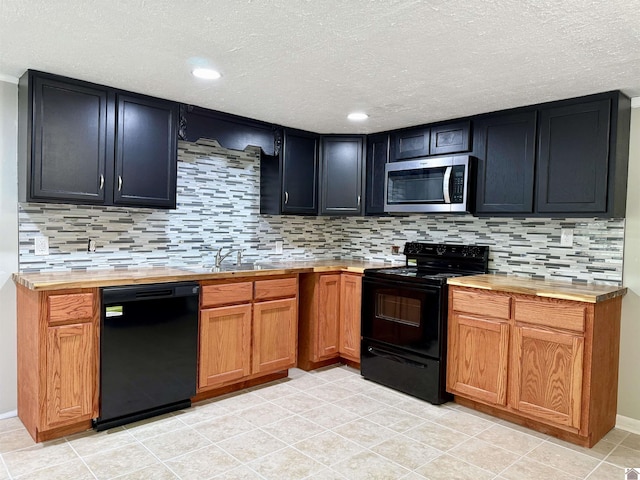 403 N 19th St, Paducah, KY 42001 - kitchen featuring black appliances, decorative backsplash, a textured ceiling, light tile patterned floors, and recessed lighting
