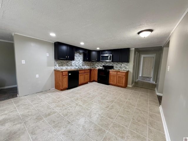 403 N 19th St, Paducah, KY 42001 - kitchen featuring black appliances, a textured ceiling, decorative backsplash, light countertops, and light tile patterned floors