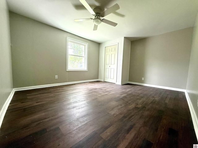 403 N 19th St, Paducah, KY 42001 - unfurnished bedroom featuring dark wood-style flooring, ceiling fan, and a closet