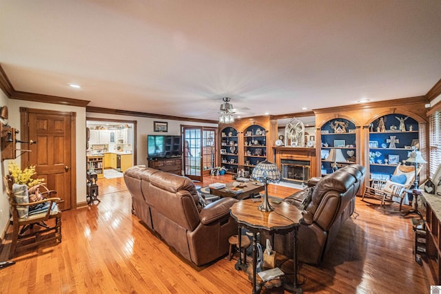 1201 Winslow Way, Paducah, KY 42001 - living room with ornamental molding, a glass covered fireplace, light wood-style flooring, ceiling fan, and recessed lighting