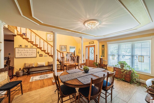 1201 Winslow Way, Paducah, KY 42001 - dining space with ornate columns, stairway, crown molding, and a raised ceiling