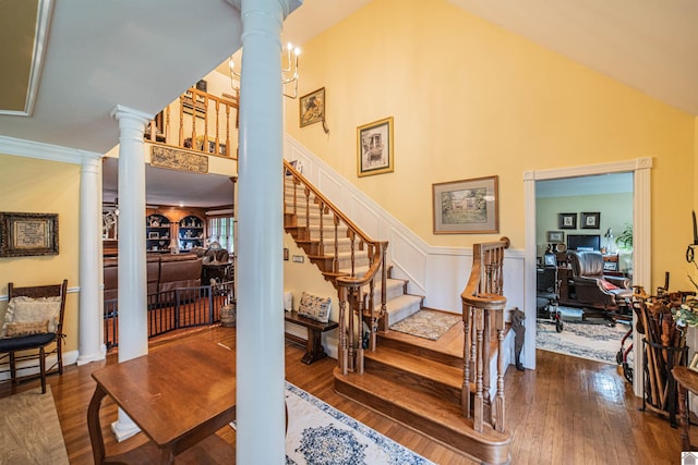 1201 Winslow Way, Paducah, KY 42001 - stairway with decorative columns, hardwood / wood-style floors, and a towering ceiling