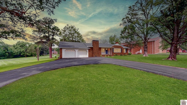 700 S 16th, Murray, KY 42071 - ranch-style home with driveway, a chimney, an attached garage, and a front yard