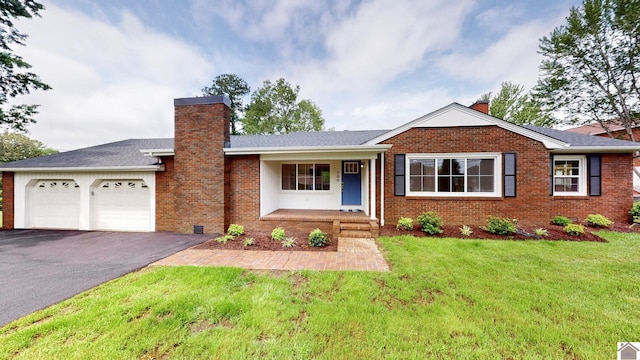 700 S 16th, Murray, KY 42071 - single story home featuring a chimney, driveway, a garage, a front lawn, and brick siding