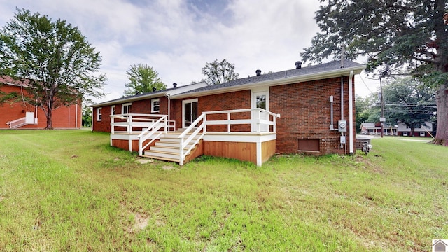 700 S 16th, Murray, KY 42071 - back of property featuring brick siding, a wooden deck, and a yard