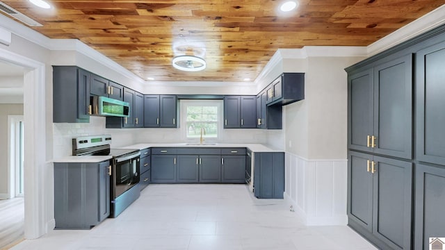 700 S 16th, Murray, KY 42071 - kitchen featuring stainless steel appliances, wood ceiling, a wainscoted wall, light countertops, and tasteful backsplash