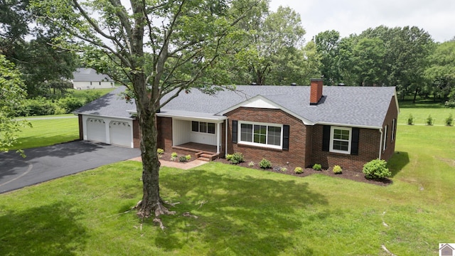 700 S 16th, Murray, KY 42071 - ranch-style house with a chimney, brick siding, driveway, a front yard, and an attached garage