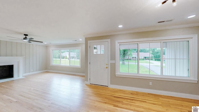 700 S 16th, Murray, KY 42071 - unfurnished living room with ornamental molding, light wood-style flooring, a fireplace with flush hearth, ceiling fan, and recessed lighting