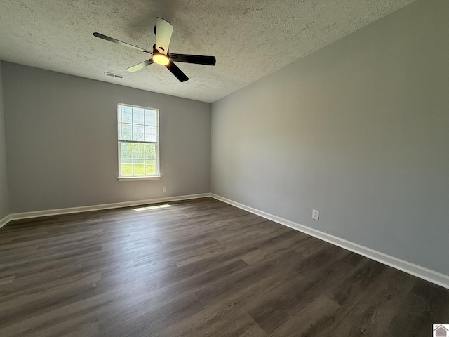 2042 Carneal Ln, Oak Grove, KY 42262 - unfurnished room with dark wood-style floors, a textured ceiling, and ceiling fan