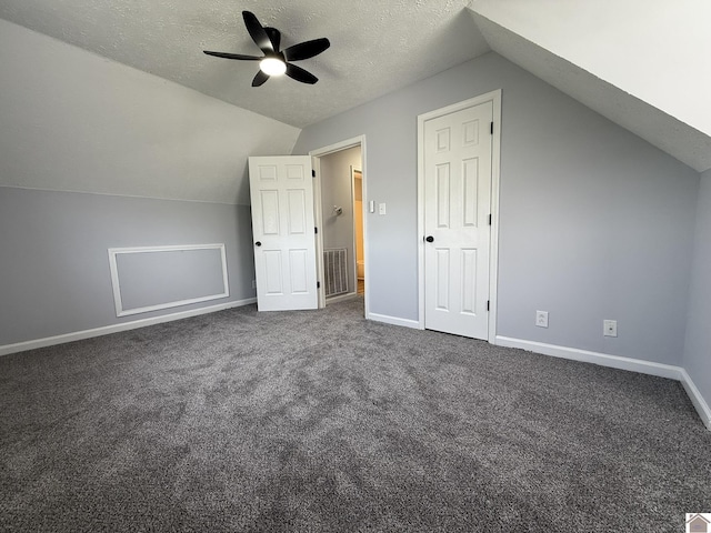 2042 Carneal Ln, Oak Grove, KY 42262 - additional living space with lofted ceiling, ceiling fan, a textured ceiling, and dark colored carpet