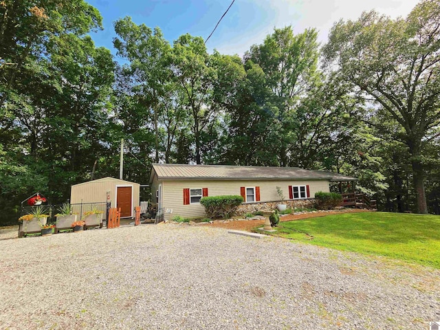 1040 Shine Ln, Cadiz, KY 42211 - view of front of home featuring a storage shed, a front yard, and driveway