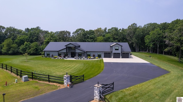 1 Logan Trl, Murray, KY 42071 - view of front of property with a garage and asphalt driveway