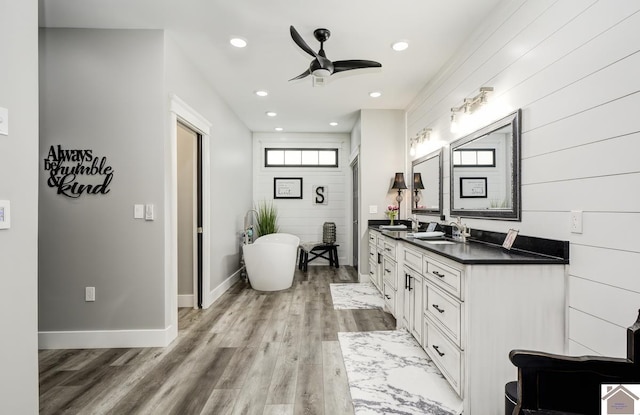 1 Logan Trl, Murray, KY 42071 - full bath with double vanity, a soaking tub, a ceiling fan, wood finished floors, and recessed lighting