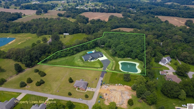 1 Logan Trl, Murray, KY 42071 - aerial view of property and surrounding area with property parcel outlined and a nearby body of water