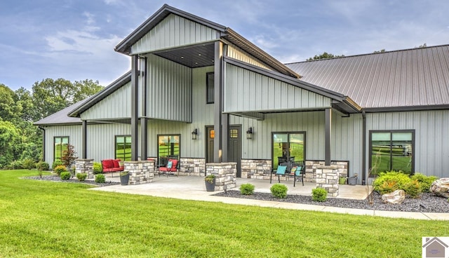 1 Logan Trl, Murray, KY 42071 - back of property with a lawn, a patio, and stone siding