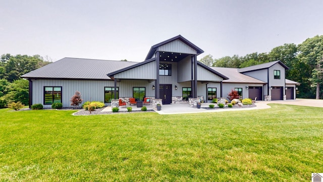 1 Logan Trl, Murray, KY 42071 - rear view of house featuring a yard, concrete driveway, and a garage