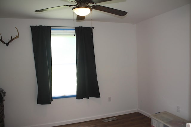 779 State Route 564, Mayfield, KY 42066 - empty room featuring a ceiling fan, healthy amount of natural light, and dark wood finished floors