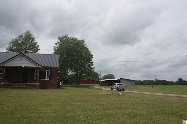 779 State Route 564, Mayfield, KY 42066 - view of grassy yard with a porch and driveway