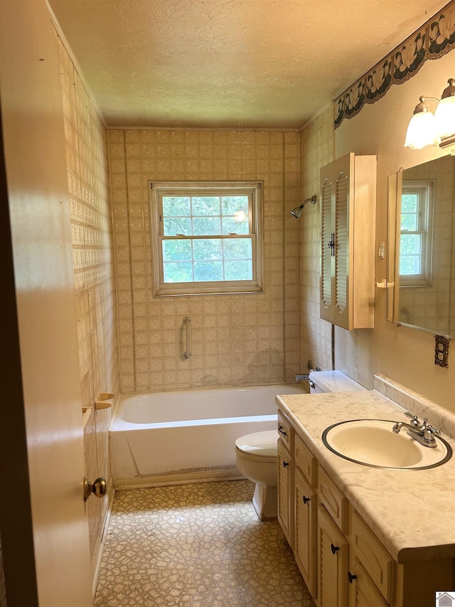 2153 Horace Barnes Rd, Calvert City, KY 42029 - bathroom with plenty of natural light, a textured ceiling, and vanity
