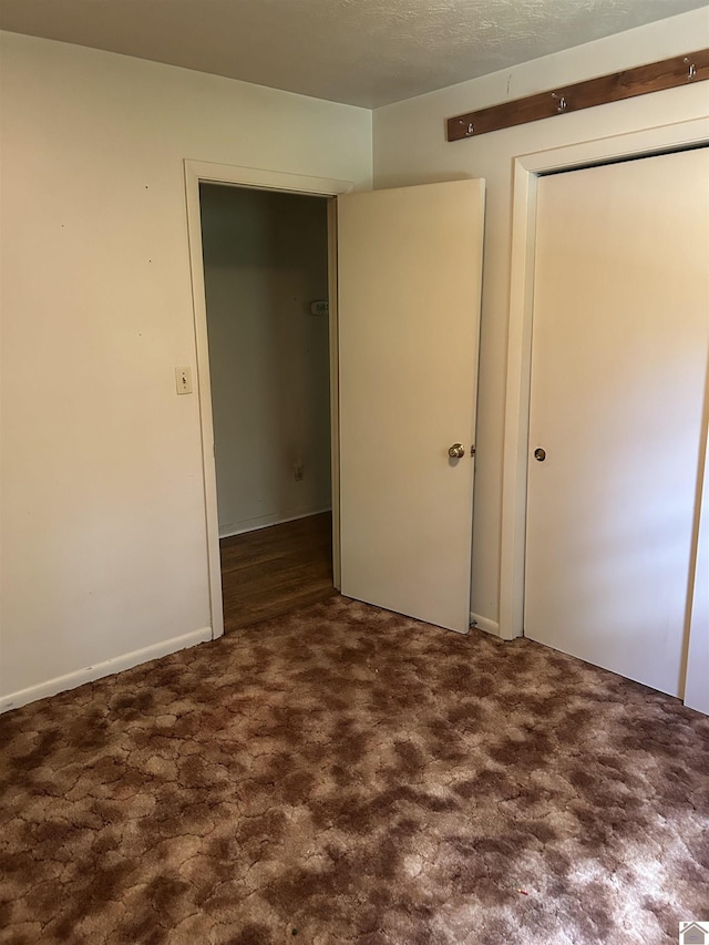 2153 Horace Barnes Rd, Calvert City, KY 42029 - unfurnished bedroom with carpet flooring and a closet