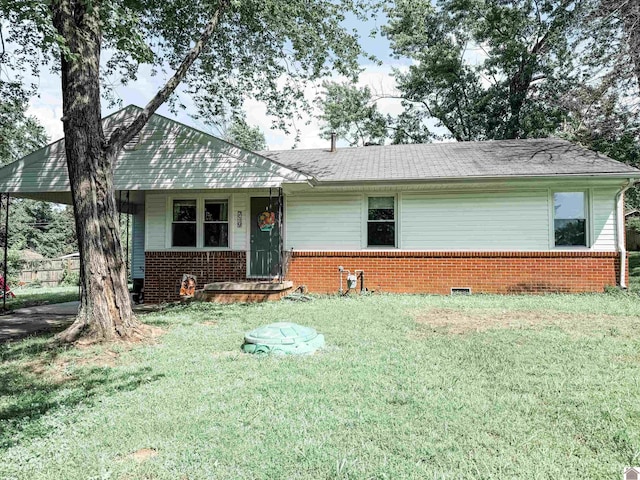 719 Elder St, Calvert City, KY 42029 - view of front facade with brick siding and a front yard