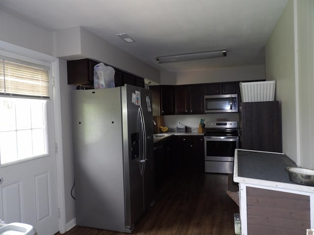 719 Elder St, Calvert City, KY 42029 - kitchen with appliances with stainless steel finishes, dark wood-type flooring, and light countertops