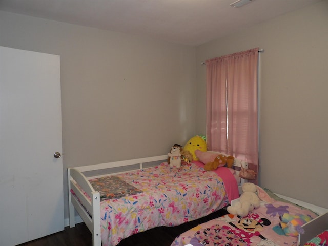 719 Elder St, Calvert City, KY 42029 - bedroom with dark wood-type flooring and baseboards