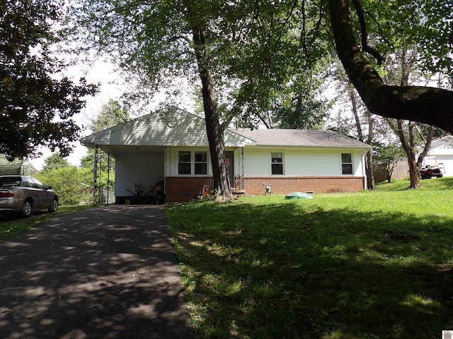 719 Elder St, Calvert City, KY 42029 - view of front of house with driveway, brick siding, a front yard, and an attached carport