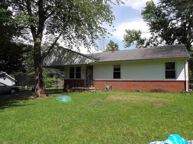 719 Elder St, Calvert City, KY 42029 - ranch-style home with brick siding and a front yard