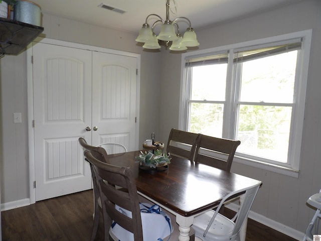 719 Elder St, Calvert City, KY 42029 - dining room with a chandelier, dark wood finished floors, and healthy amount of natural light