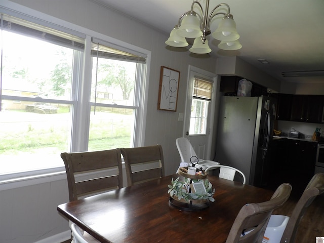719 Elder St, Calvert City, KY 42029 - dining room with a chandelier and plenty of natural light