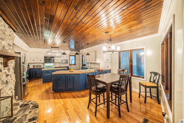 150 Sills Ln, Benton, KY 42025 - dining area with wood ceiling, a chandelier, light wood finished floors, and ornamental molding