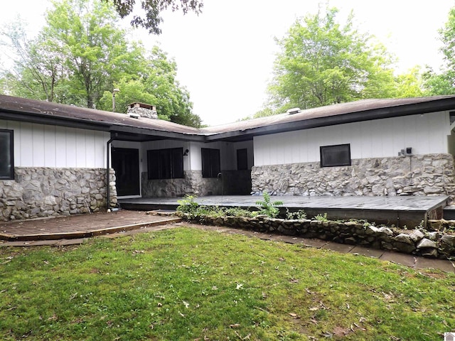 150 Sills Ln, Benton, KY 42025 - view of front of property featuring stone siding, a front lawn, and a deck