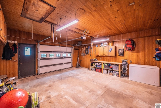 150 Sills Ln, Benton, KY 42025 - garage featuring wooden walls, a garage door opener, and wood ceiling