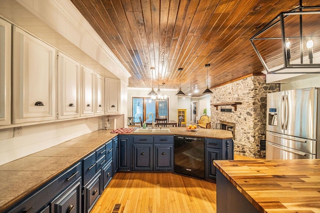 150 Sills Ln, Benton, KY 42025 - kitchen featuring stainless steel fridge, black dishwasher, butcher block countertops, wooden ceiling, and a chandelier