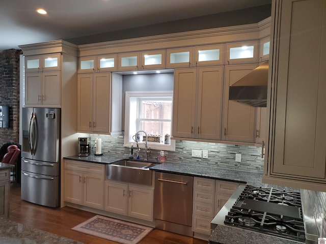 117 N 2nd, Paducah, KY 42001 - kitchen featuring appliances with stainless steel finishes, custom range hood, tasteful backsplash, dark wood finished floors, and glass insert cabinets