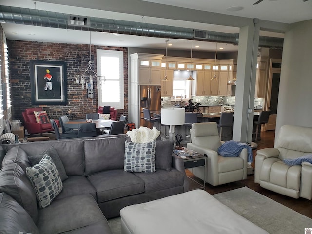 117 N 2nd, Paducah, KY 42001 - living room with brick wall and wood finished floors