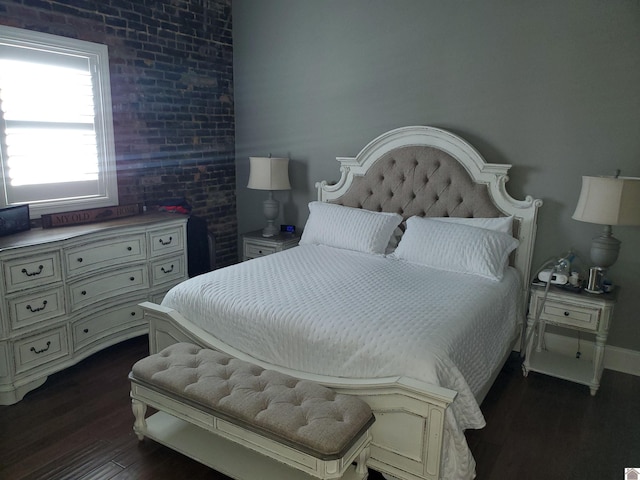 117 N 2nd, Paducah, KY 42001 - bedroom featuring dark wood-style flooring and baseboards