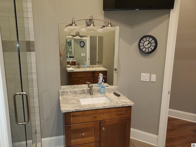 117 N 2nd, Paducah, KY 42001 - bathroom with vanity, a stall shower, and wood finished floors