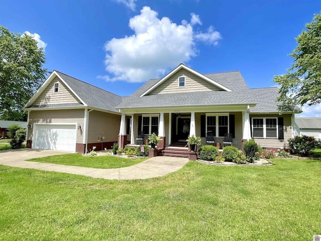 1514 Martin Chapel, Murray, KY 42071 - craftsman-style home featuring covered porch, roof with shingles, a front yard, concrete driveway, and a garage