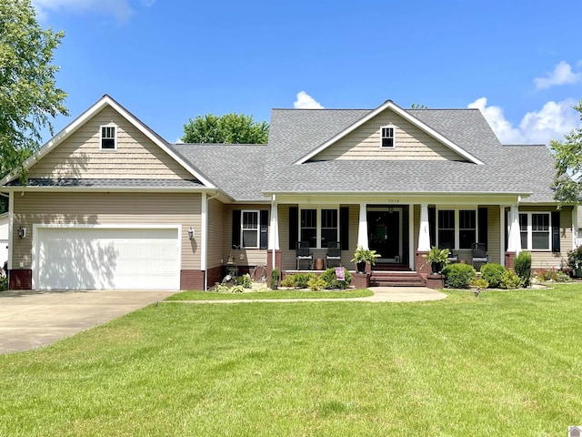 1514 Martin Chapel, Murray, KY 42071 - view of front of home featuring a shingled roof, covered porch, a garage, a front lawn, and concrete driveway