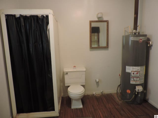 517 Milliken Rd, Paducah, KY 42003 - full bath with water heater, wood finished floors, and a shower with curtain