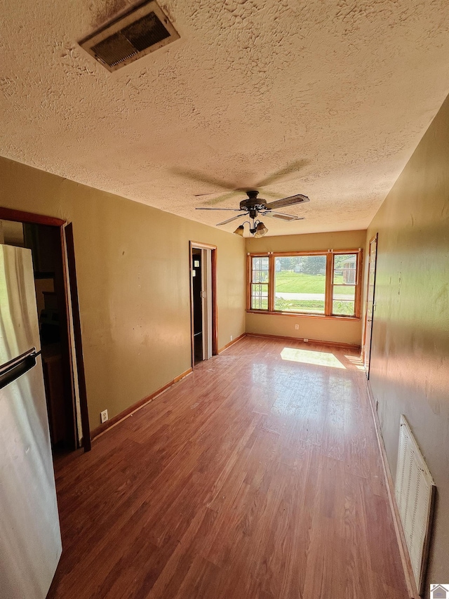 524 S Seminary St, Princeton, KY 42445 - unfurnished room featuring a textured ceiling, wood finished floors, and ceiling fan