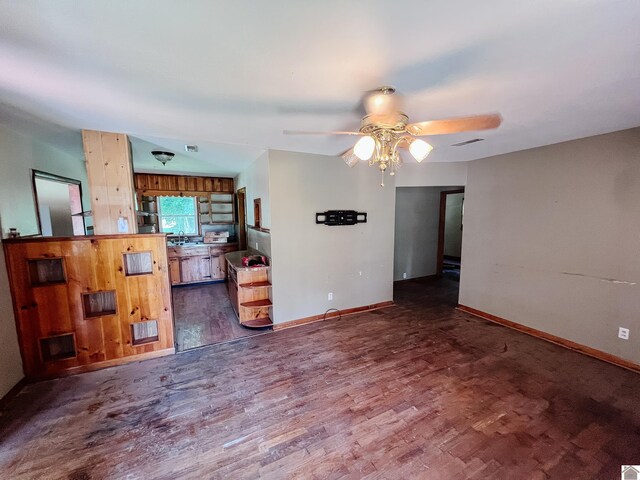 524 S Seminary St, Princeton, KY 42445 - unfurnished living room featuring wood finished floors and ceiling fan
