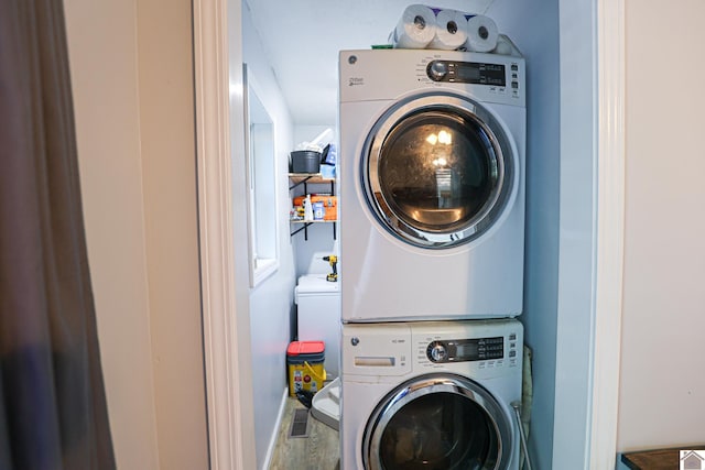 1715 State Route 80 W, Arlington, KY 42021 - washroom featuring estacked washer and dryer and wood finished floors